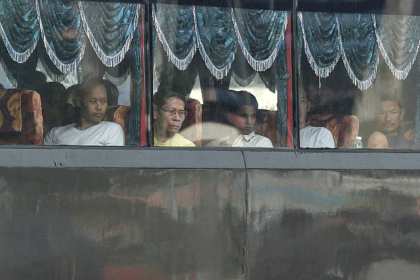 Myanmar nationals prepare to leave Malaysia aboard vessels during the first phase of the country's repatriation programme.